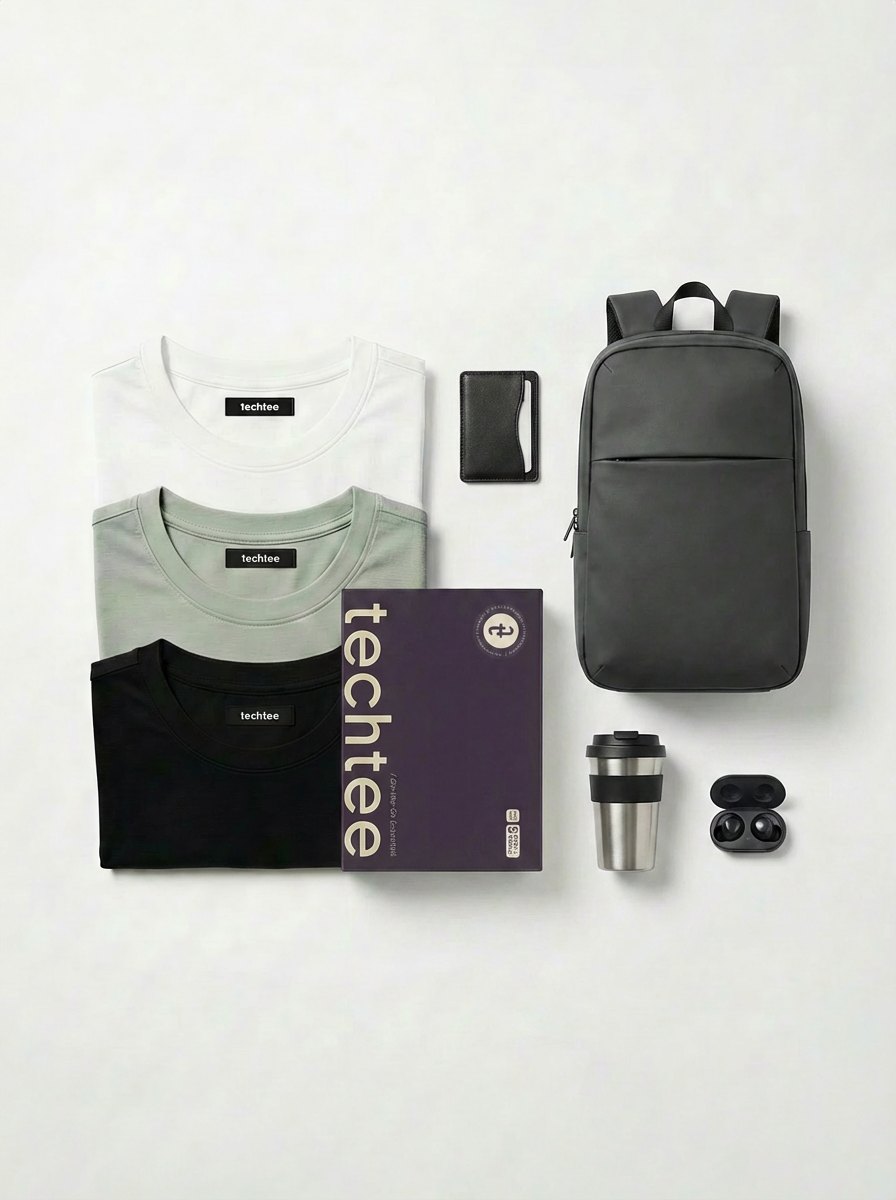 Collection of tech accessories including t-shirts, a backpack, and a travel mug on a white background with 'techtee' branding.