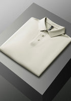 Grey polo shirt on a reflective surface