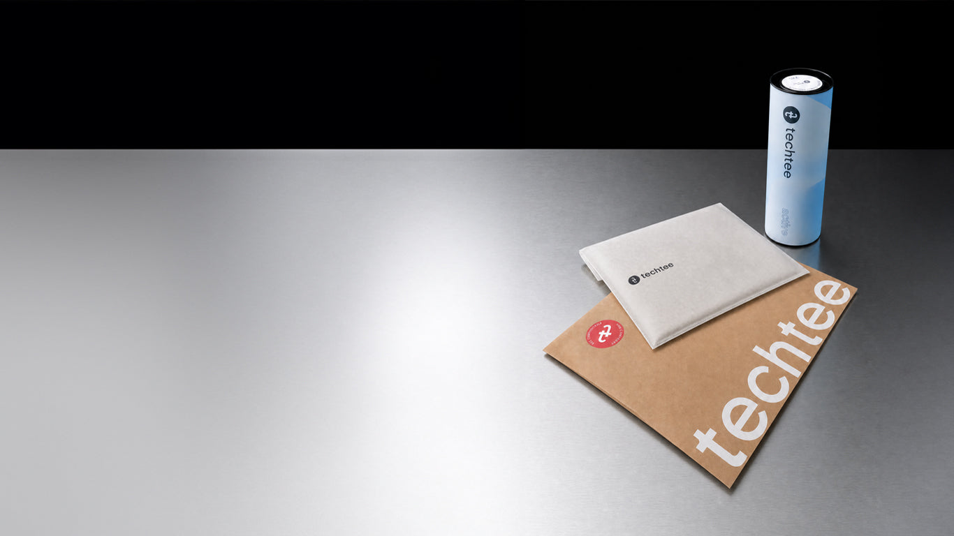 Product packaging with 'techtee' branding on a reflective surface
