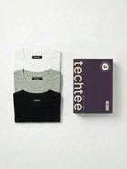 Three folded t-shirts in black, gray, and white with a 'techtee' box on a white background.
