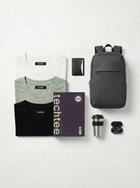 Collection of tech accessories including t-shirts, a backpack, and a travel mug on a white background with 'techtee' branding.